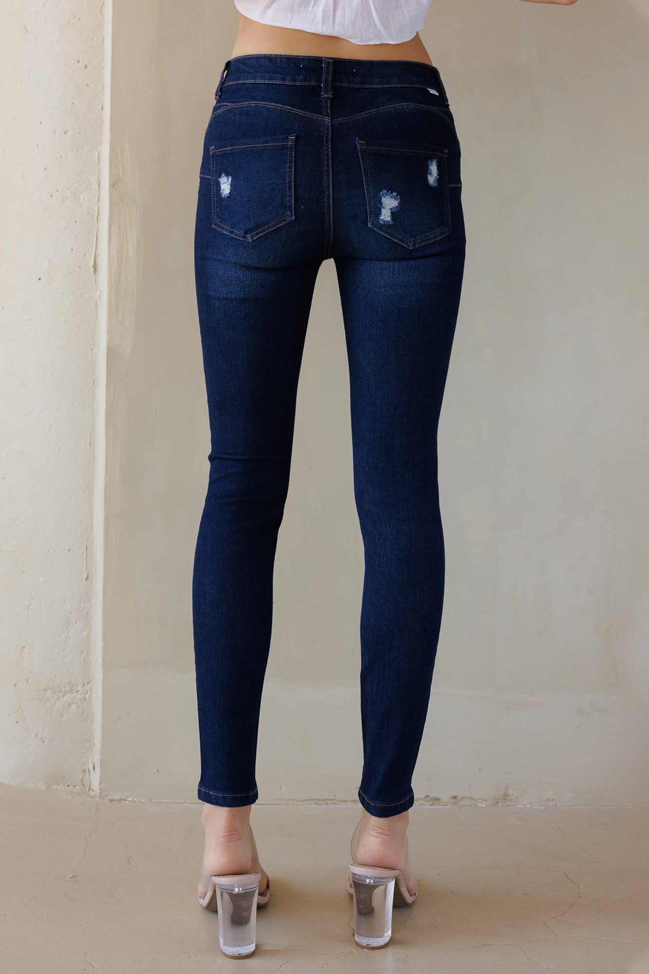 Mid Rise Destructed Push Up Skinny Jeans