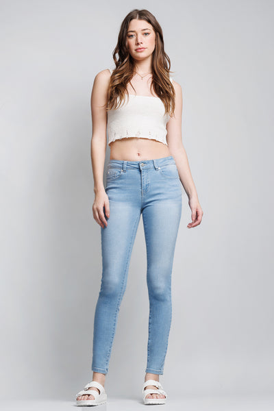 Jeans ajustados al tobillo de tiro medio