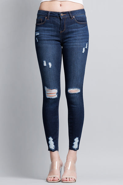 Distressed Mid Rise Skinny Jeans with Chewed Hems