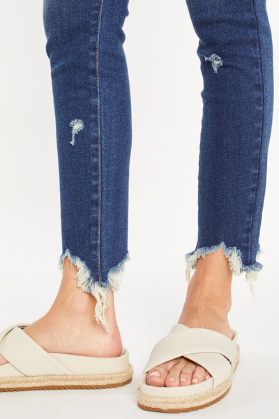 Pantalón pitillo de tiro superalto con dobladillo deshilachado muy masticado